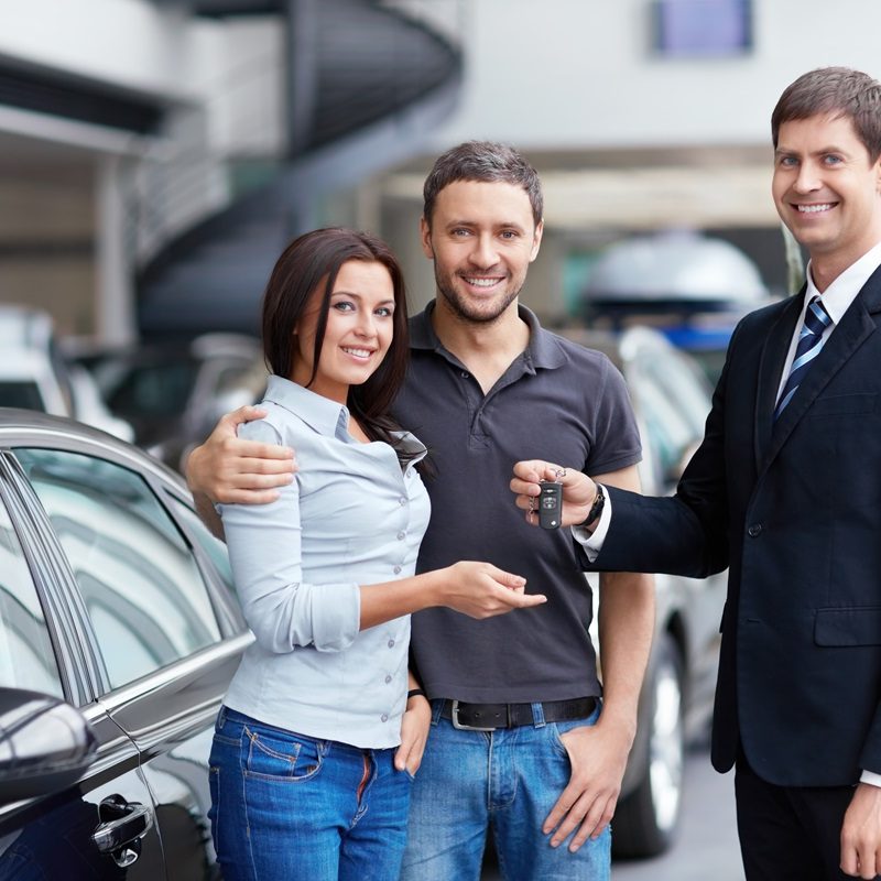 Seller,And,A,Couple,Of,With,The,Keys,To,Car